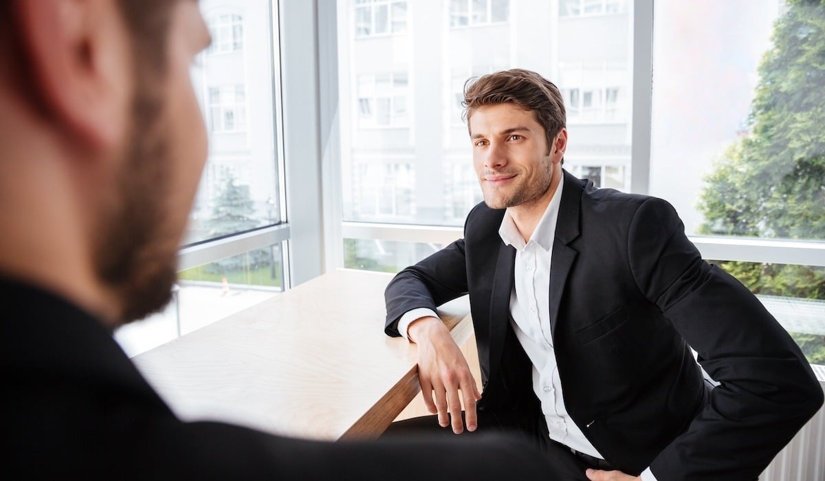 businessman-sitting-and-talking-with-his-colleague-2023-11-27-05-32-59-utc copy